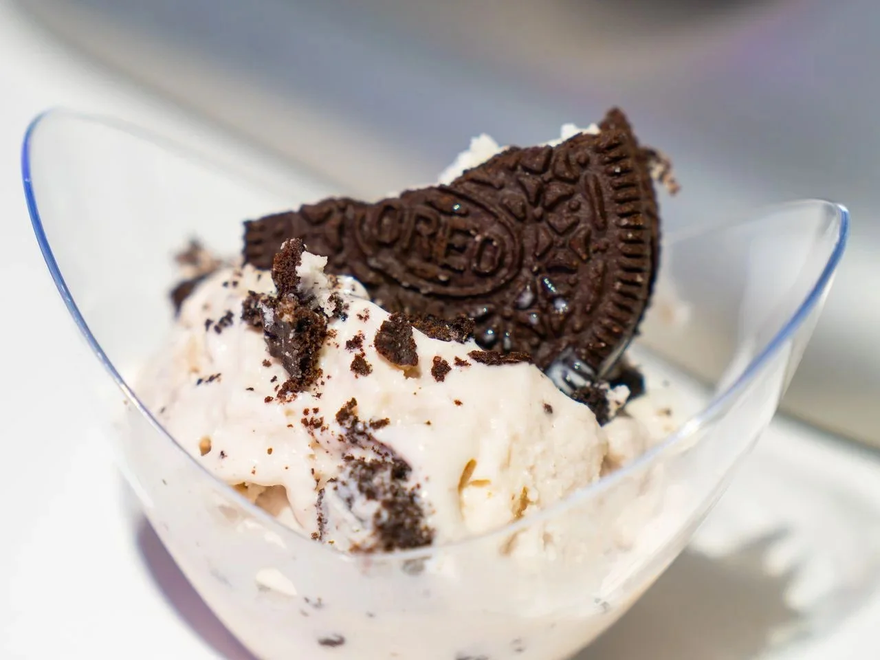 Scoop of cookies and cream liquid nitrogen ice cream topped with a cookie wedge from Freezing Point Co