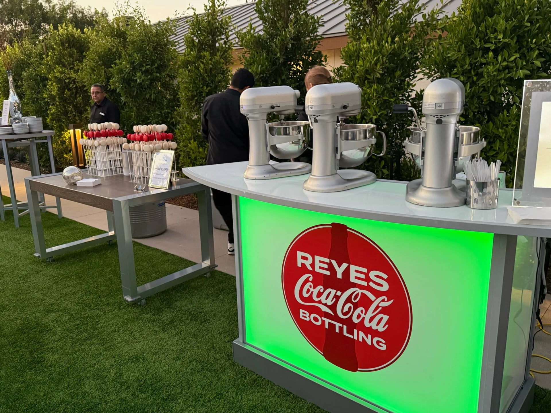 Logo Glow Bar brand activation: portable LED light-up Glow Bar branded for a bottling company, with nitrogen ice cream mixers and a NitroPop Macaron display